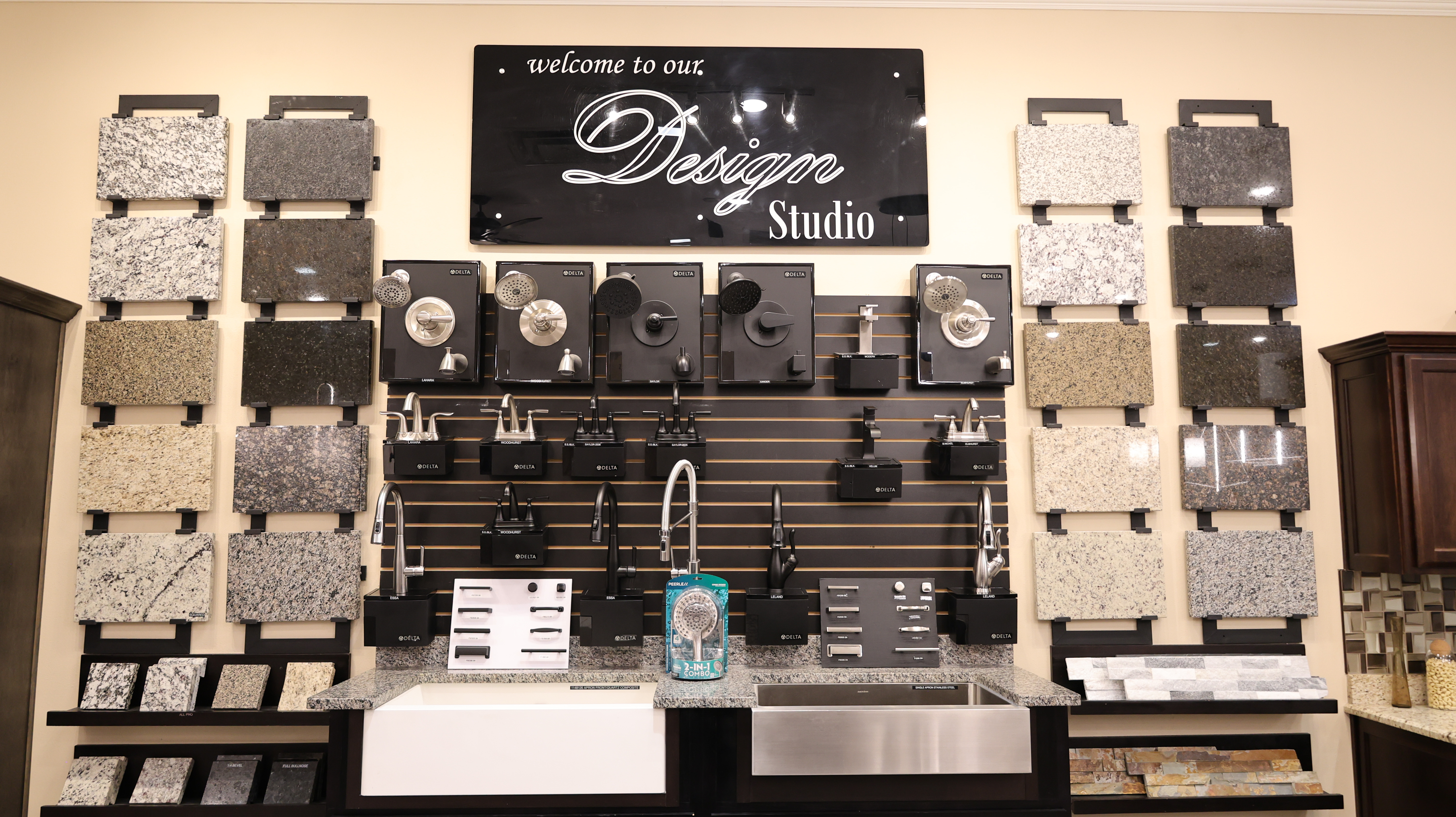 The Design Studio wall with countertops, faucets and fixtures